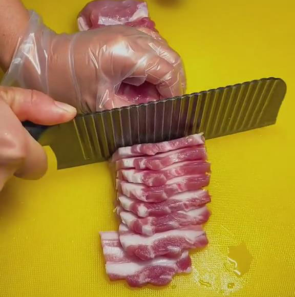 chop the pork belly into even thin slices about 1 inch wide