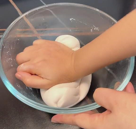 continue kneading until the oil is well incorporated into the dough