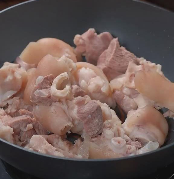 place the pork trotters into the pan