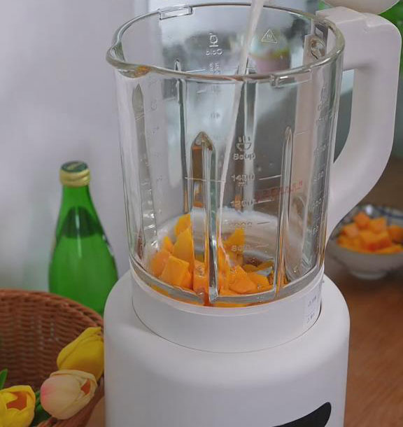 put 250g of mangoes in a blender and add 250 ml of coconut or your choice of milk