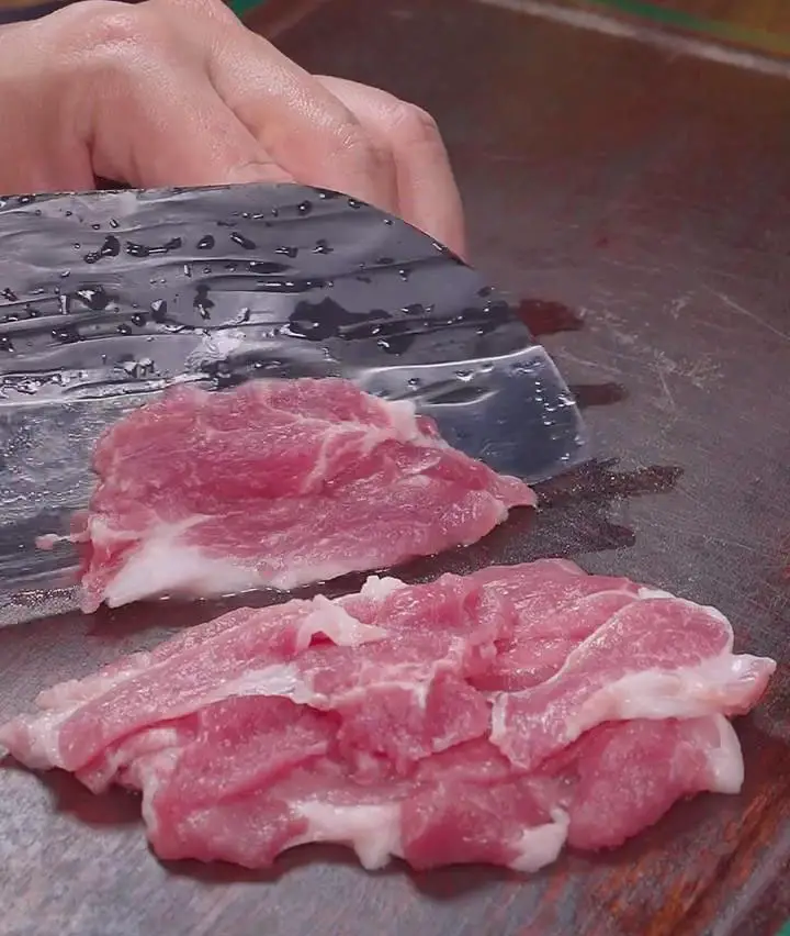 Cut the pork into thin slices