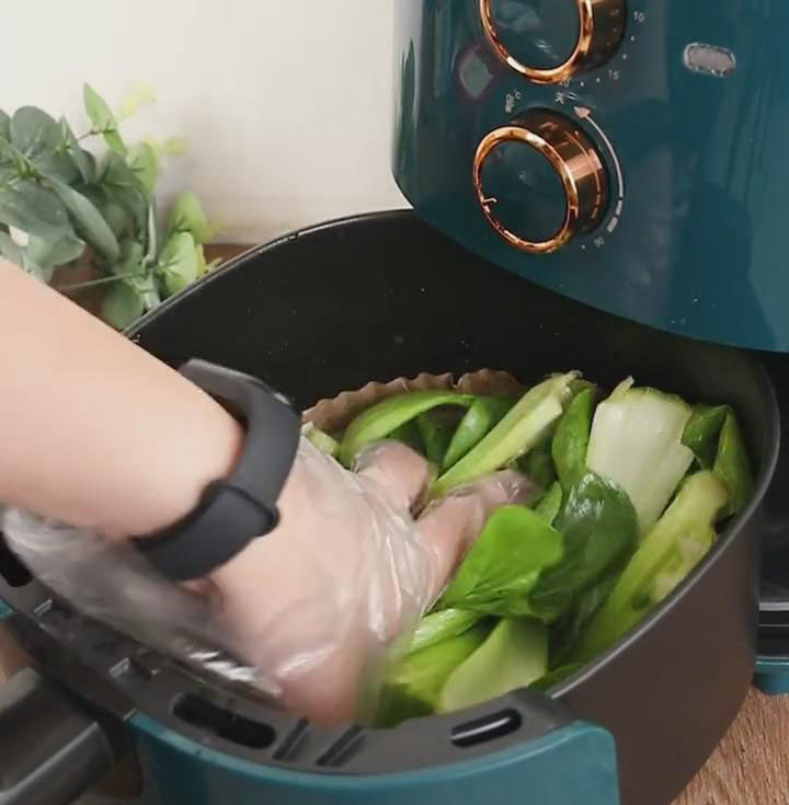 Mix the ingredients evenly by massaging them gently with the bok choy
