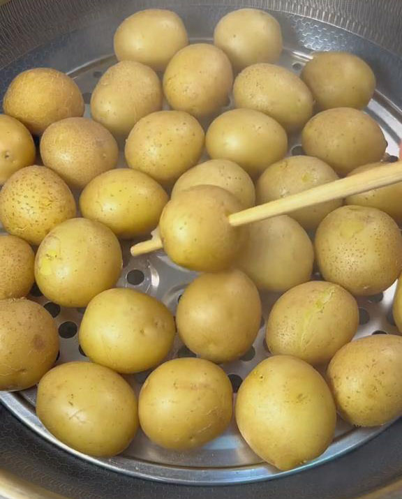 check if the potatoes are cooked by poking chopsticks