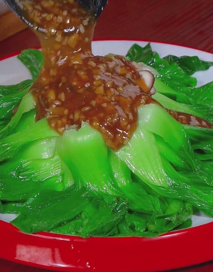 pour the savory sauce with mushrooms on top to the bok choy