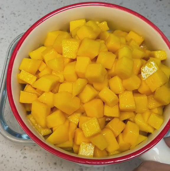 prepare the mango by cutting it into small cubes