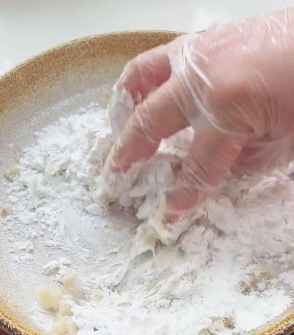 add tapioca starch and mix with your hands until it becomes fluffy chunks