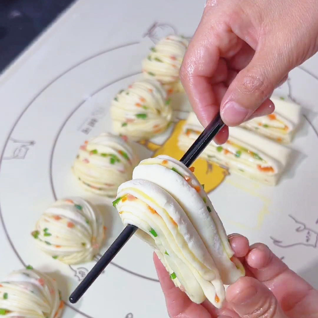 place the chopstick in the middle of the roll and fold the roll inward