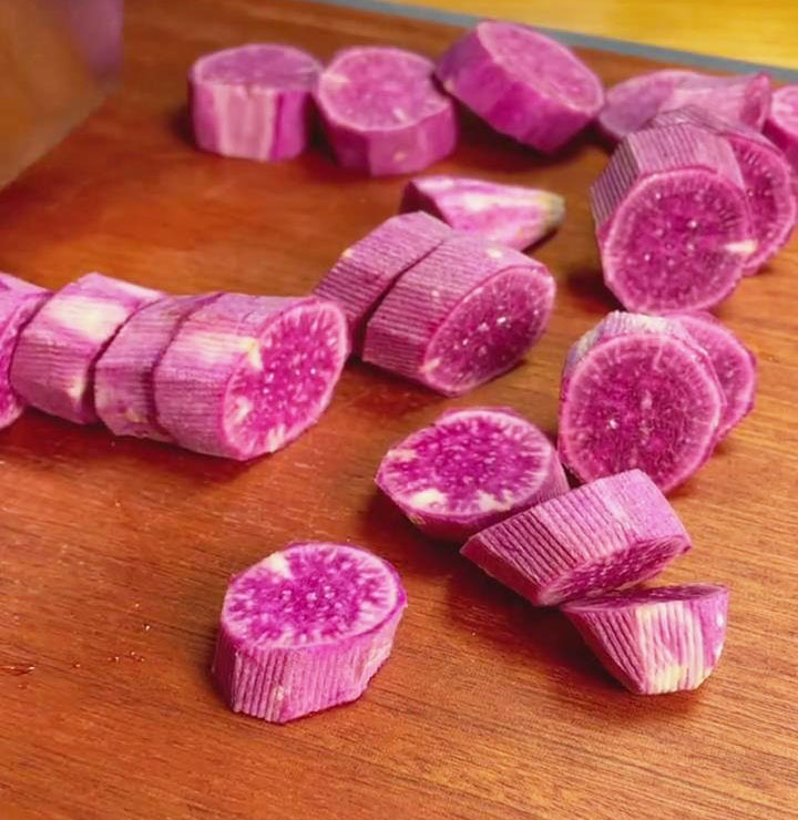 Prepare the purple sweet potatoes by peeling and cutting them into cubes