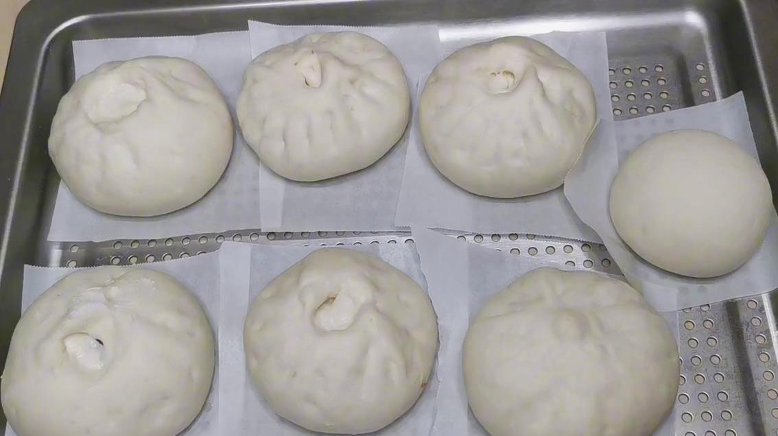 place bao in a container lined with parchment paper