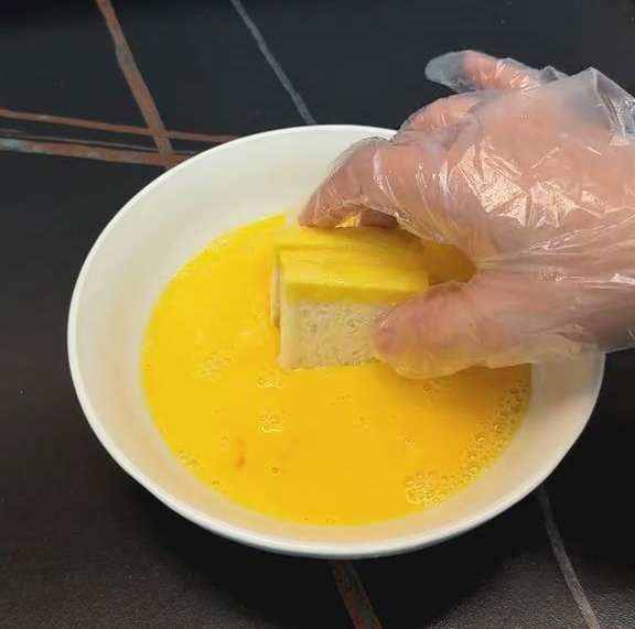 Dip the entire sandwich into the egg mixture