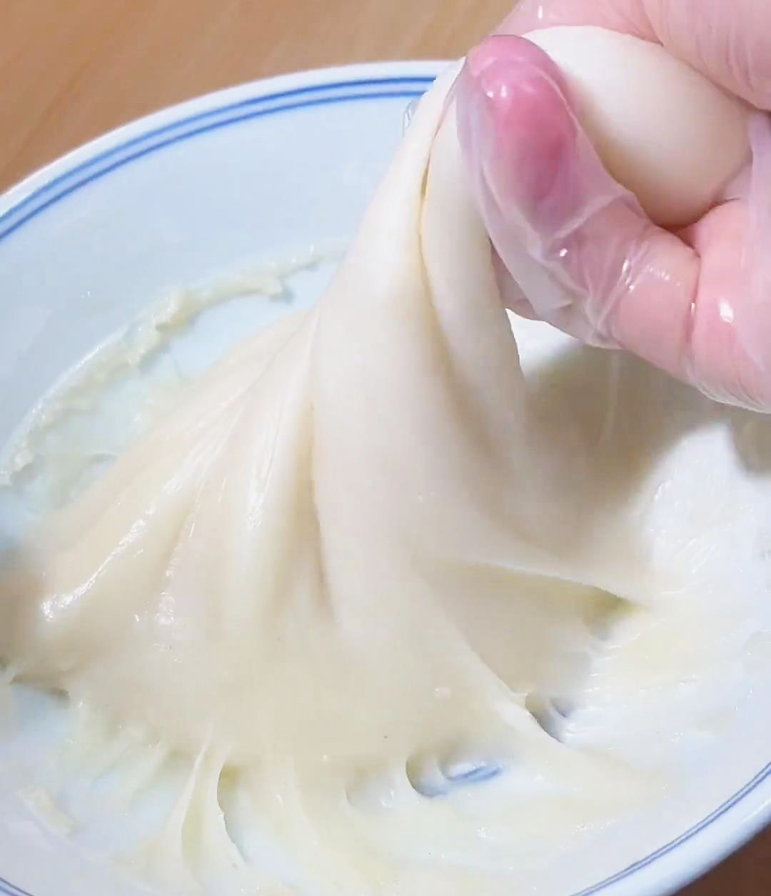 Keep mixing the dough by twisting and pulling it up with your hands