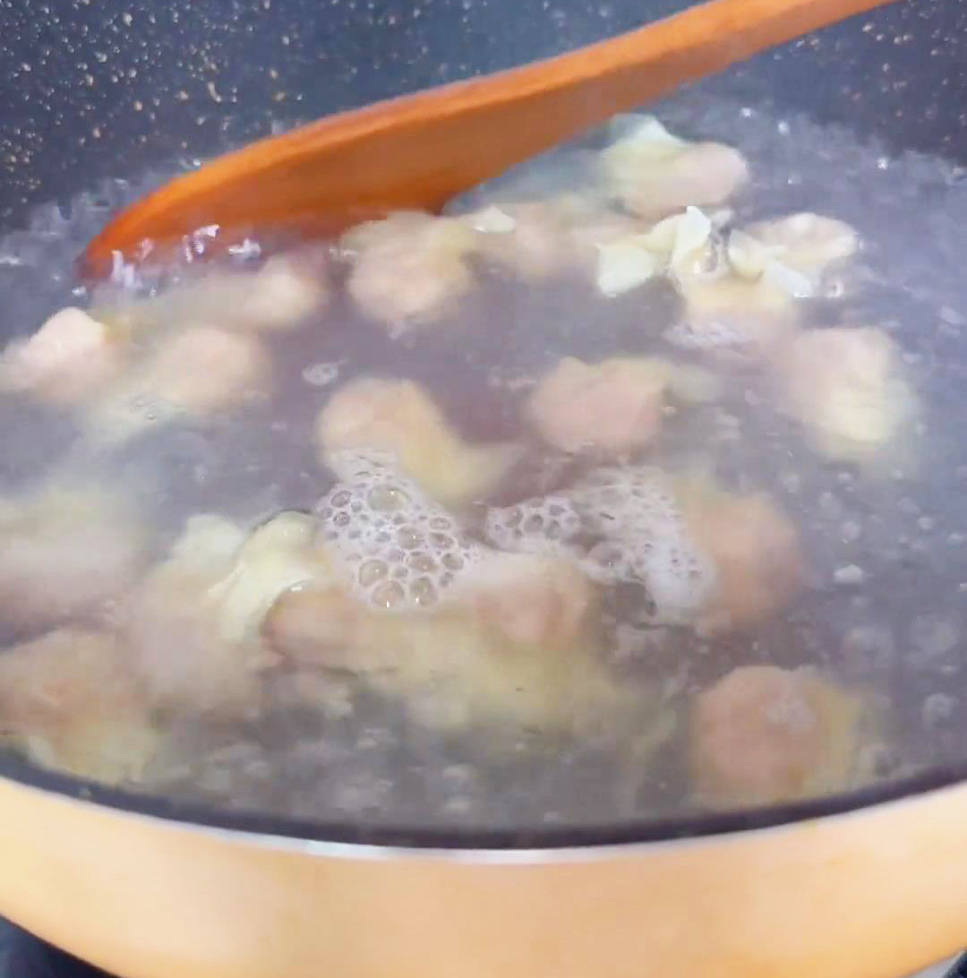 Once the water boils, add the wontons and gently stir to separate them