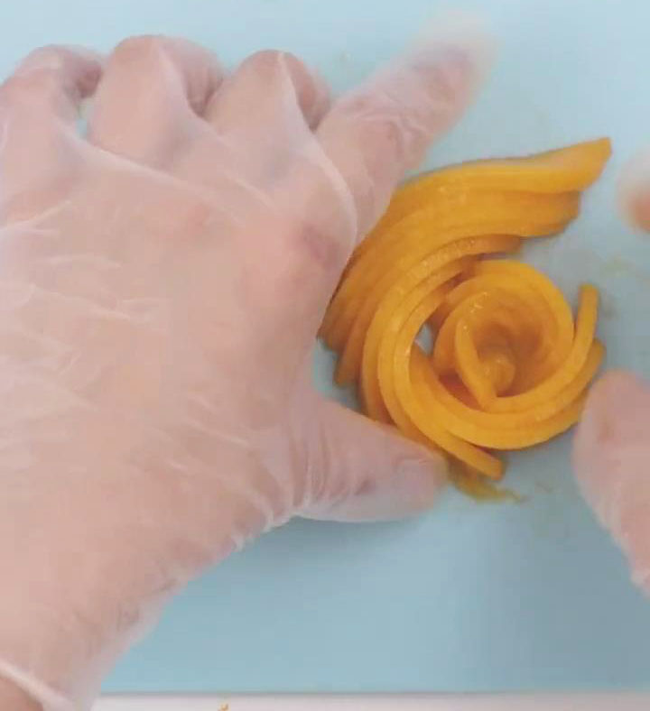 Roll the slices to form a flower like shape2