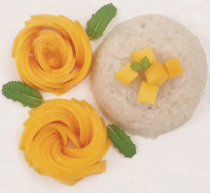 Transfer the flower mangoes onto your dessert plate with rice