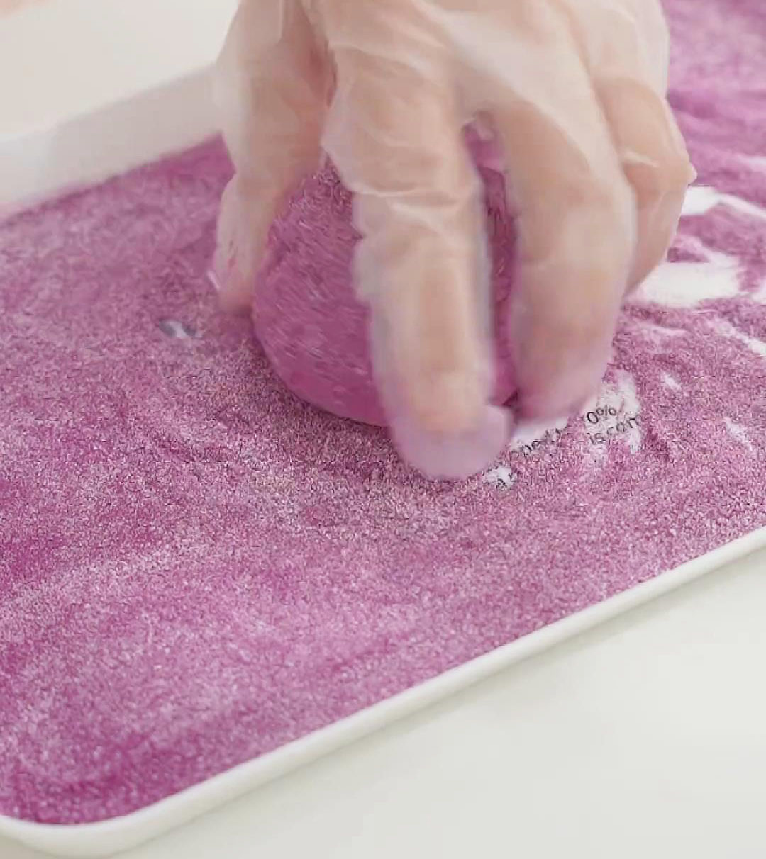 mix purple potato powder and milk powder and coat the mochi