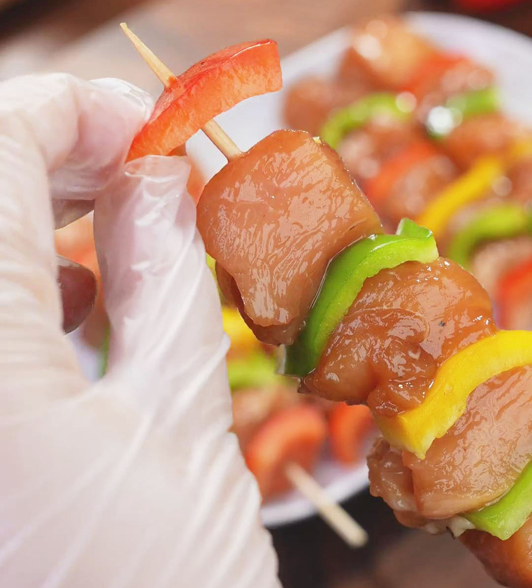 insert the marinated chicken and bell pepper slices into the skewers