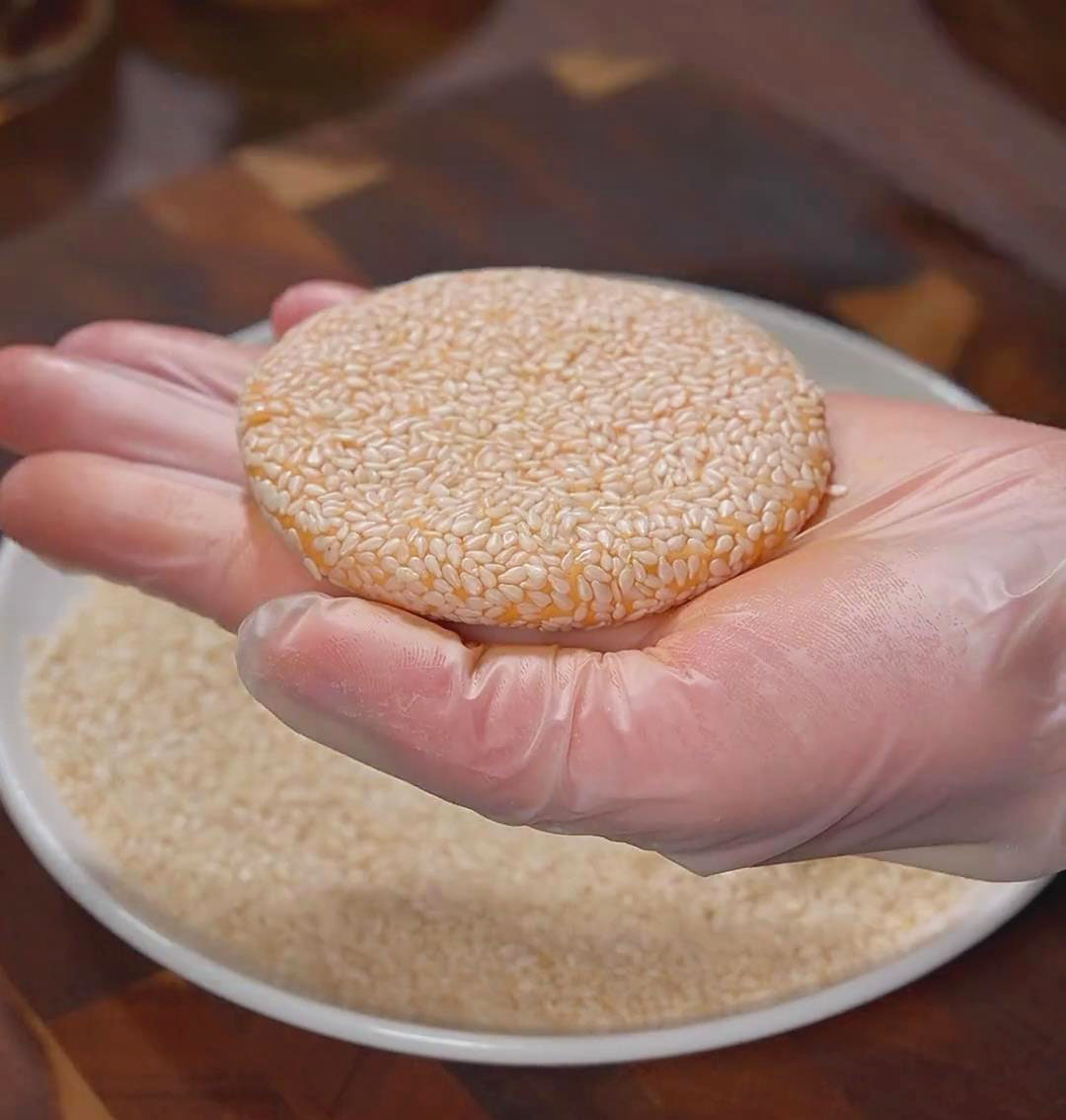 Coat each side of the pancake with white sesame seeds