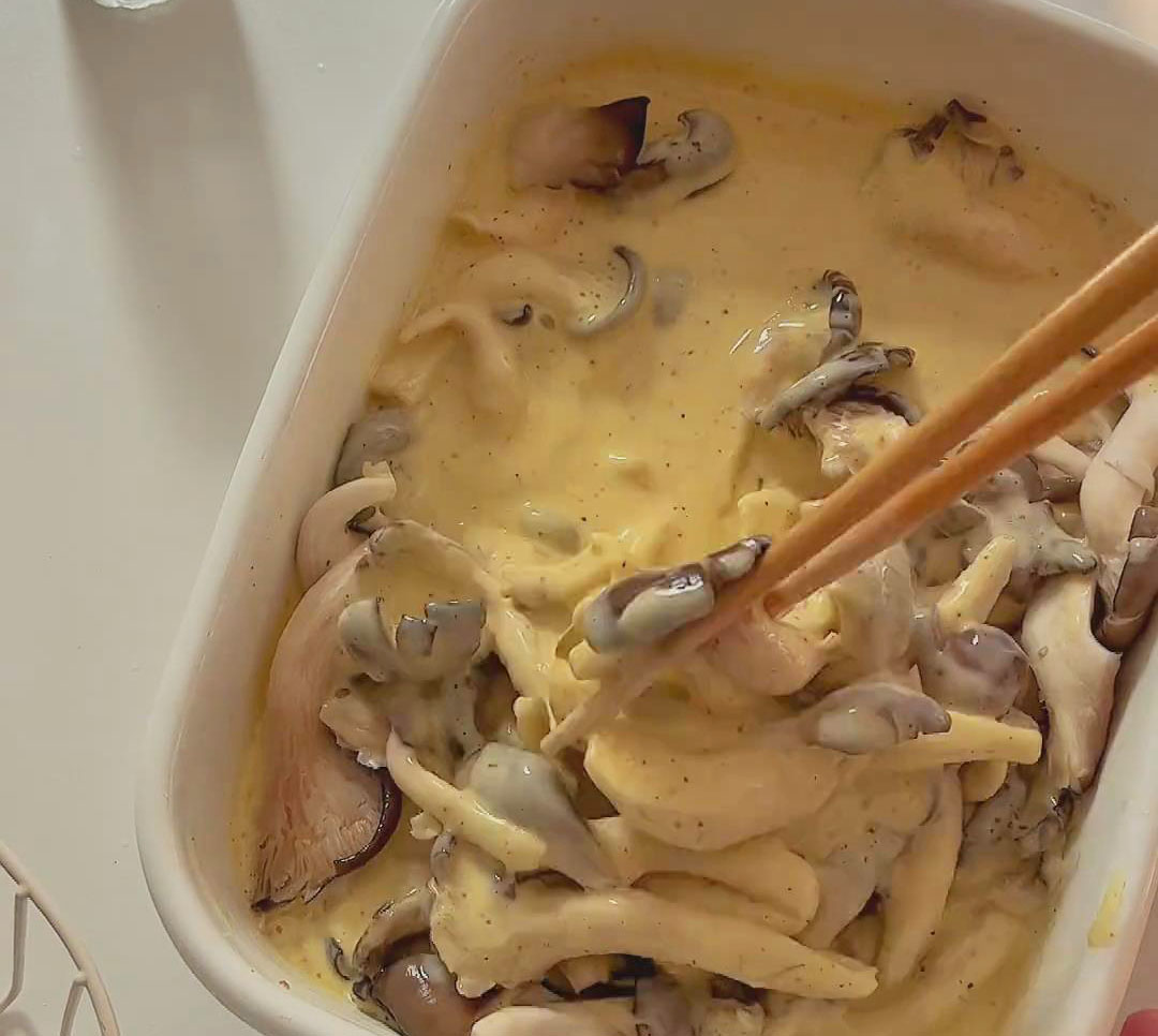 Coat the oyster mushrooms evenly with the batter