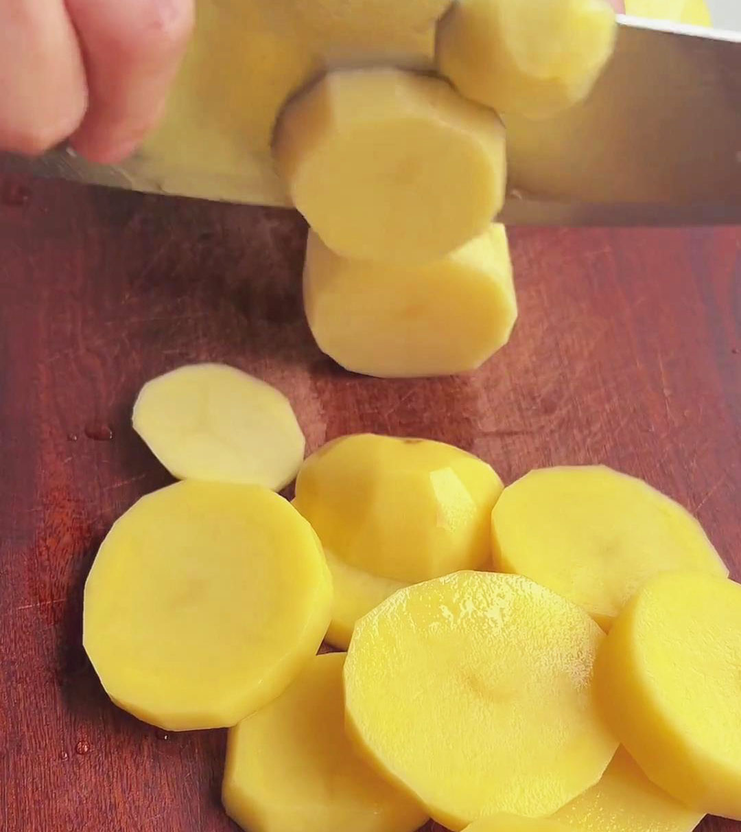 Peel and cut the potatoes into thin slices