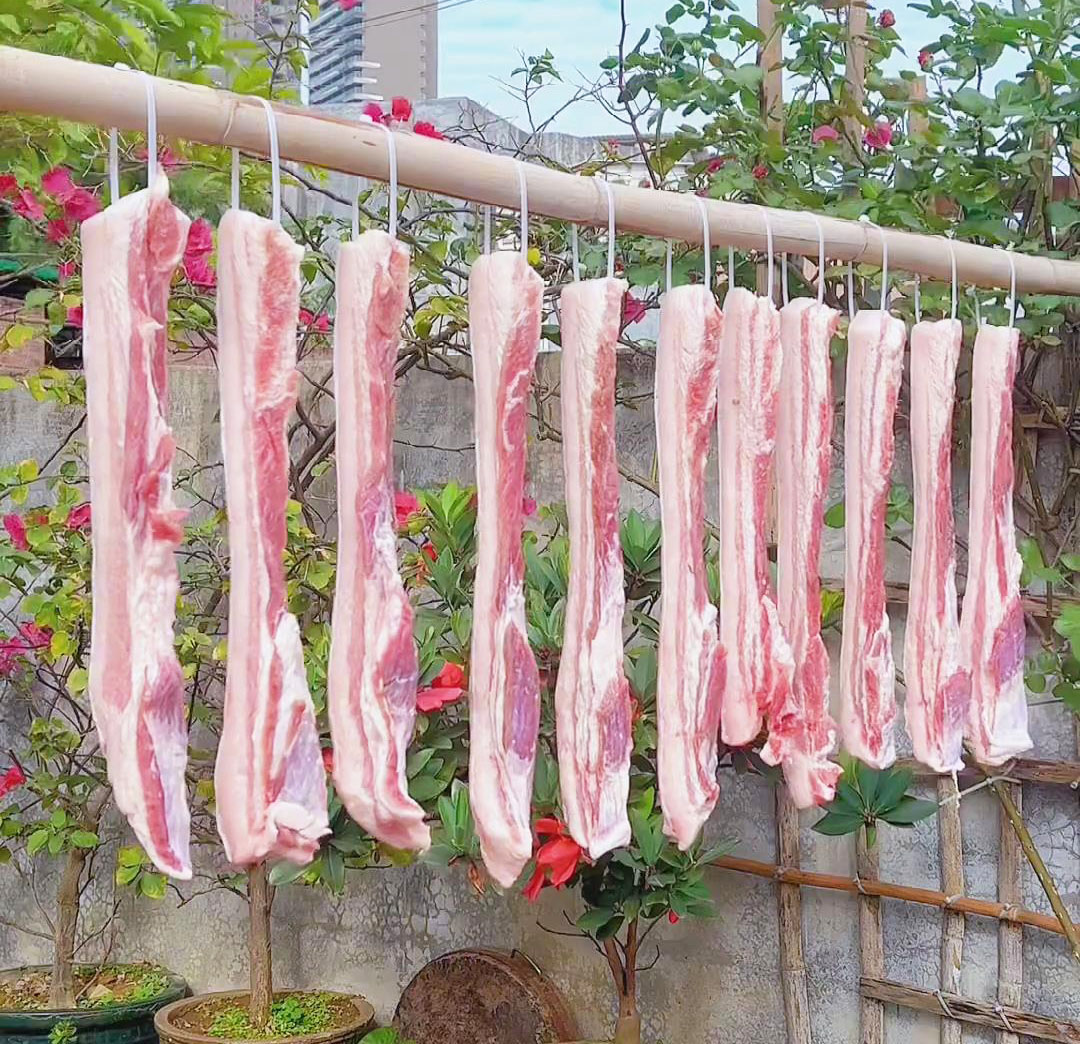 Tie the meat to the clothes hanger and hang it up
