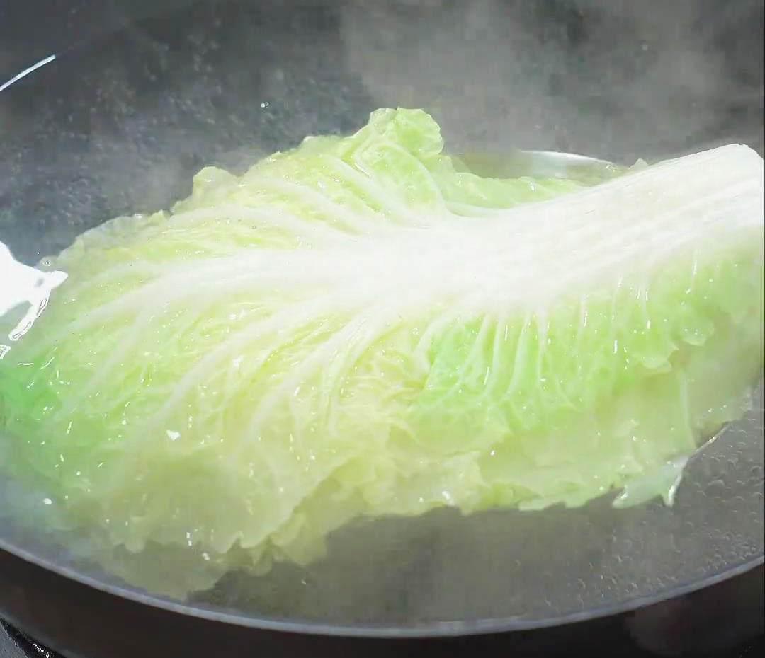 Blanch the napa cabbage leaves