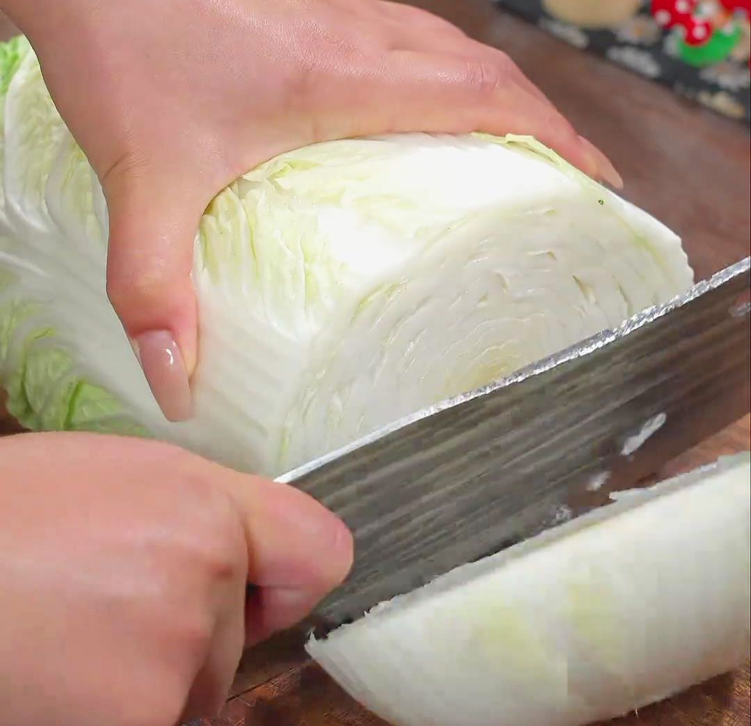 Chop off the napa cabbage base
