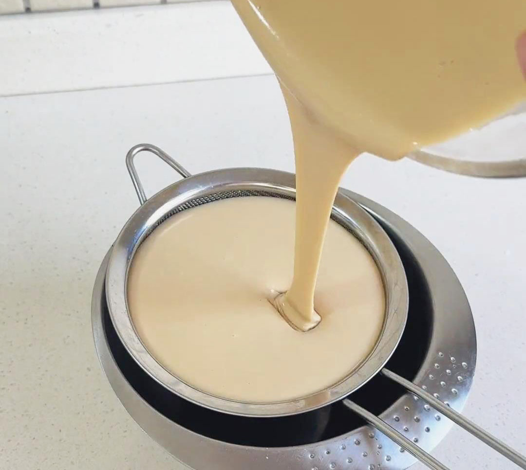 Remove large particles by pouring the mixture through a sieve