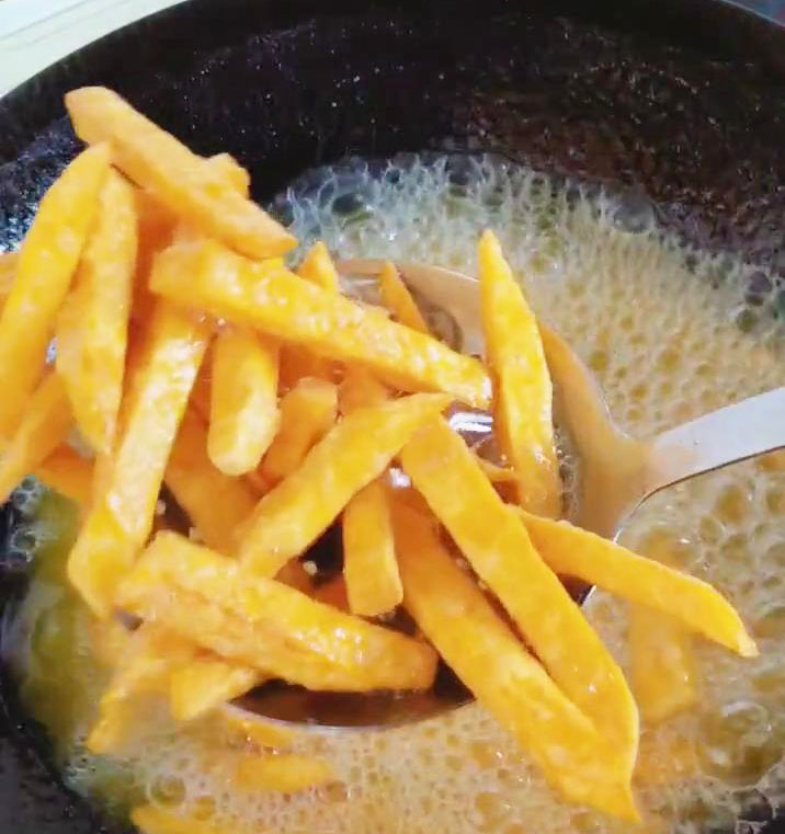 Take out the fries with a strainer