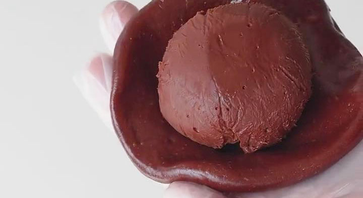 Use the prepared mochi dough to encase the frozen chocolate filling