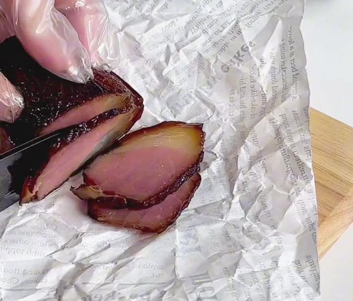 chop Chinese cured pork belly into thin round slices