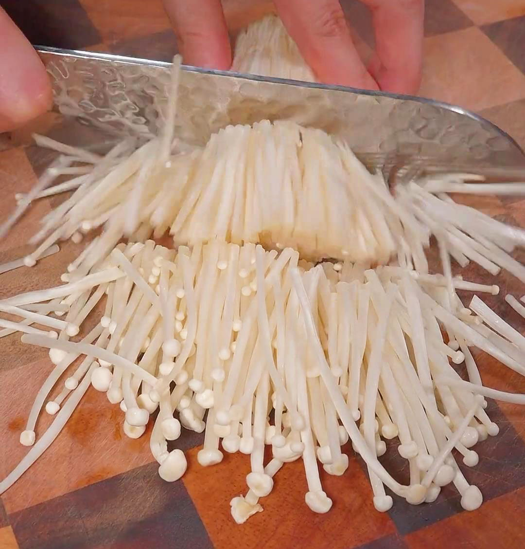 chop the enoki mushrooms into three slices