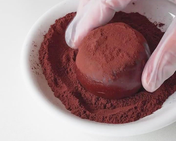 dust each piece with cocoa powder