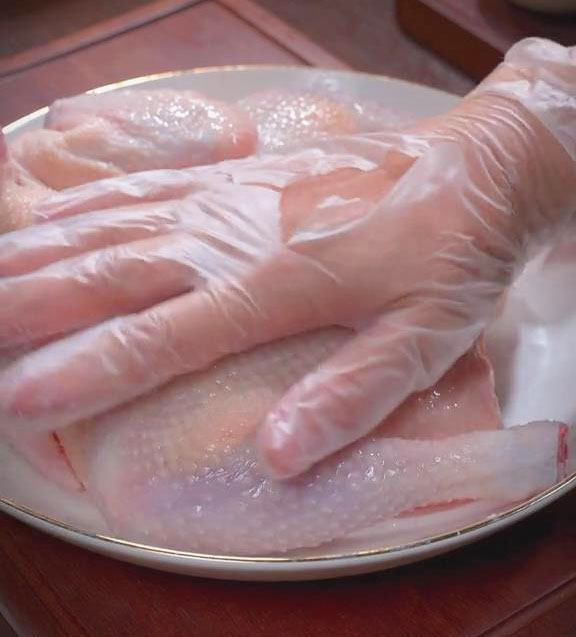 massage the chicken with salt and rice wine
