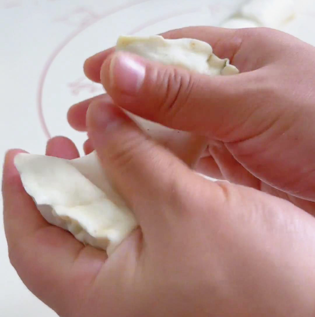 stretch out and fold the two ends to form a circular dough