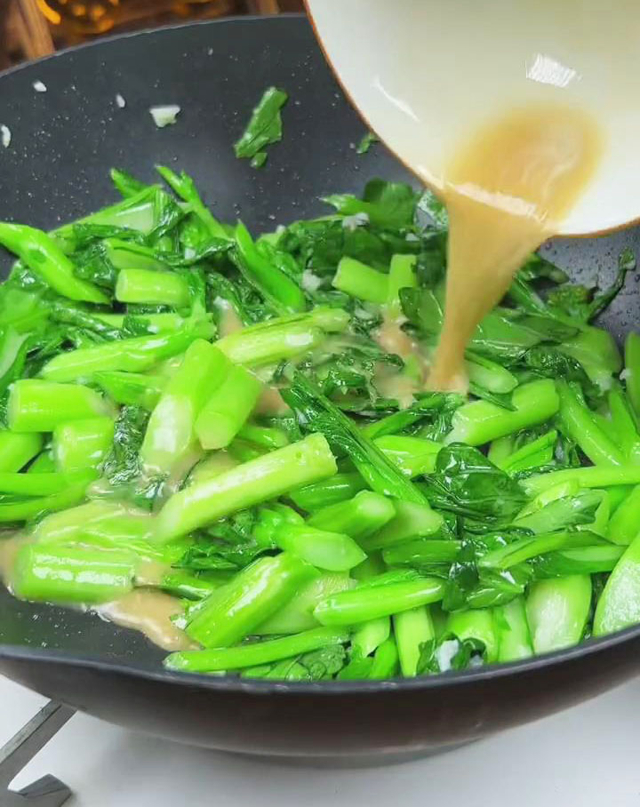 Pour the sauce mixture over the Yu Choy