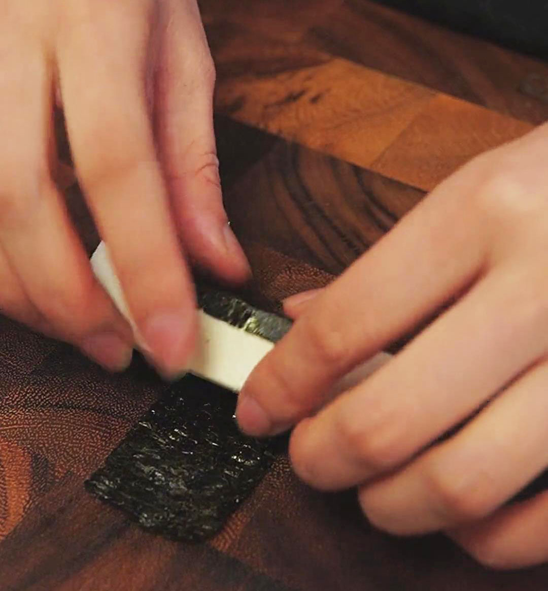 Wrap the center of the tofu in 1 inch wide nori sheets
