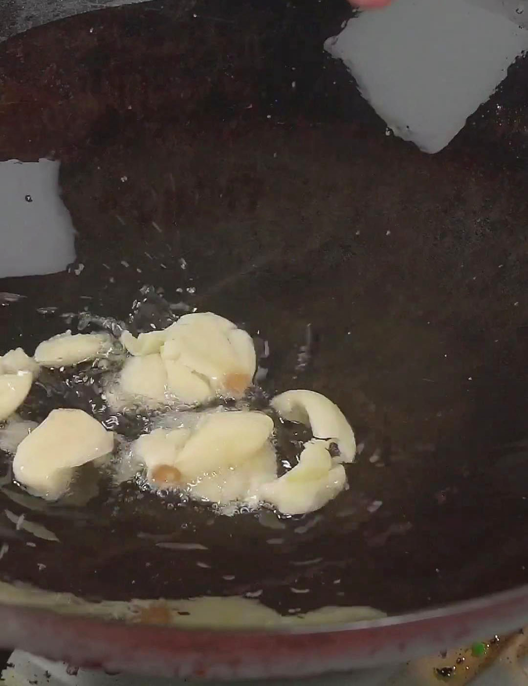 Add chopped garlic to the pan