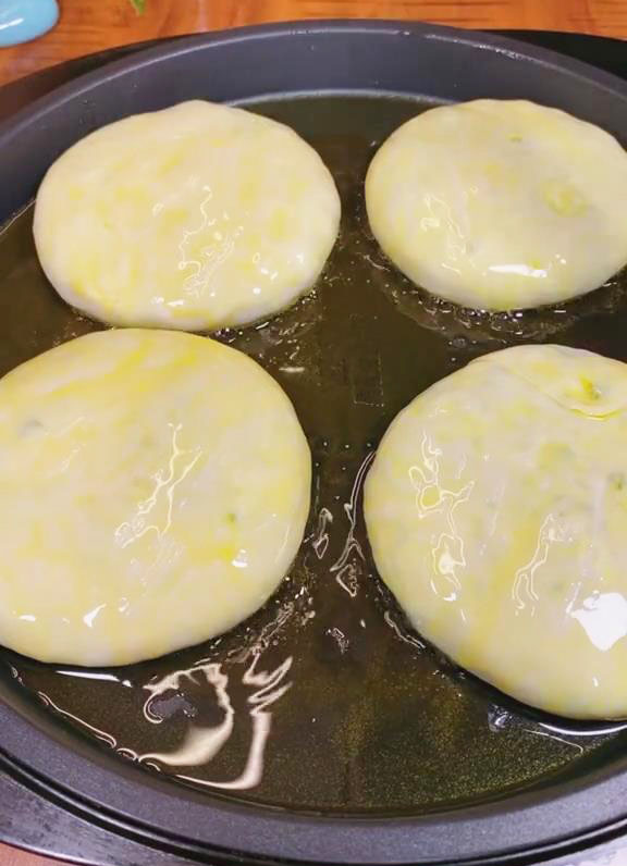 Carefully place the chive pockets in the pan