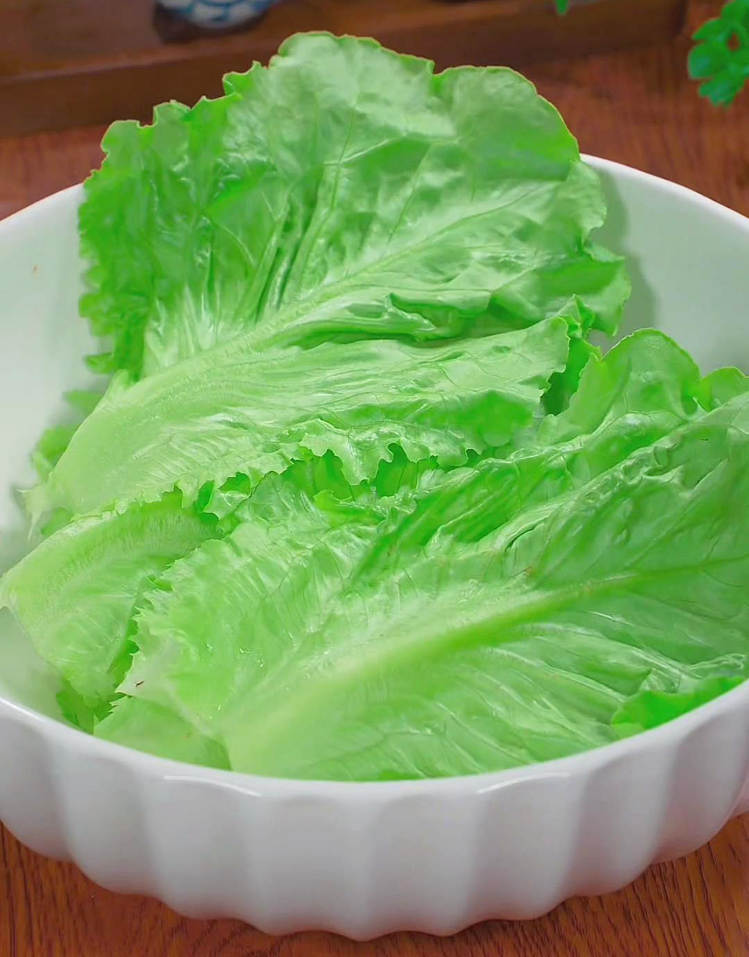 Chop the base of the lettuce, separate the leaves