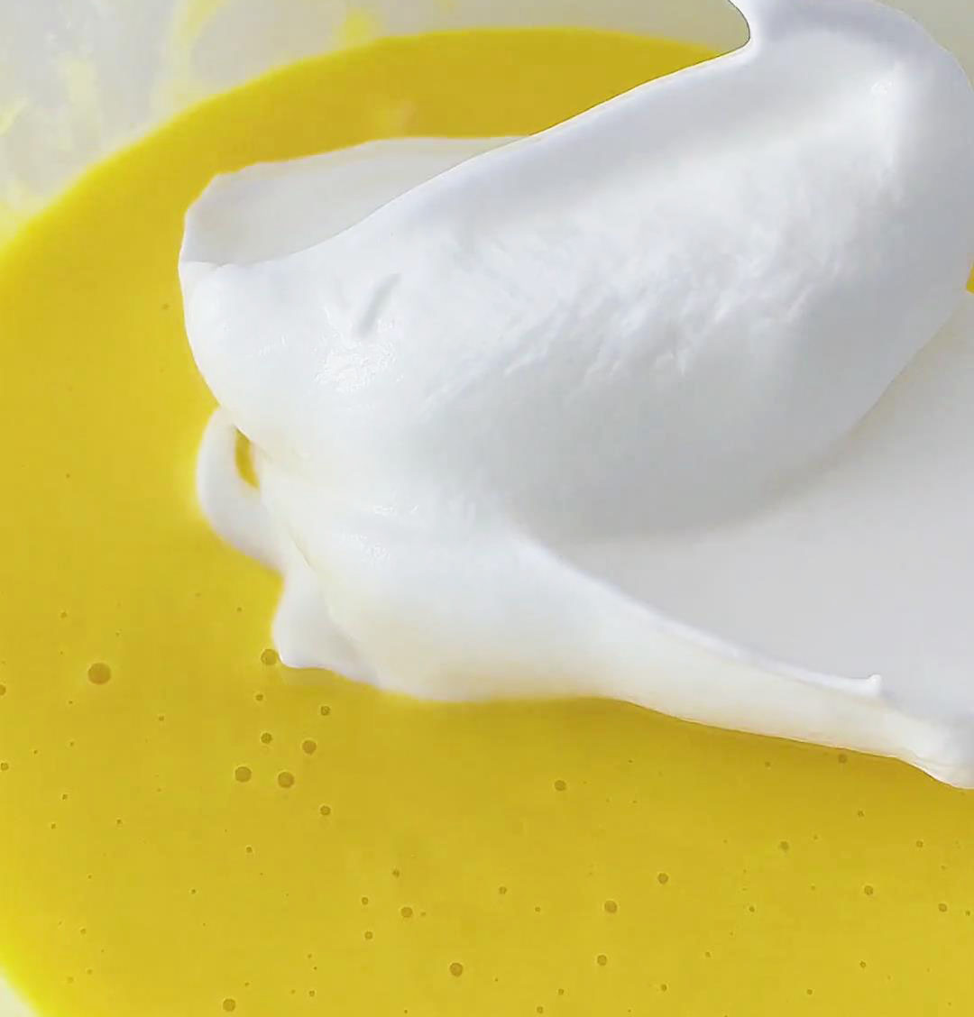 Combine half of the egg white batter with the egg yolk batter