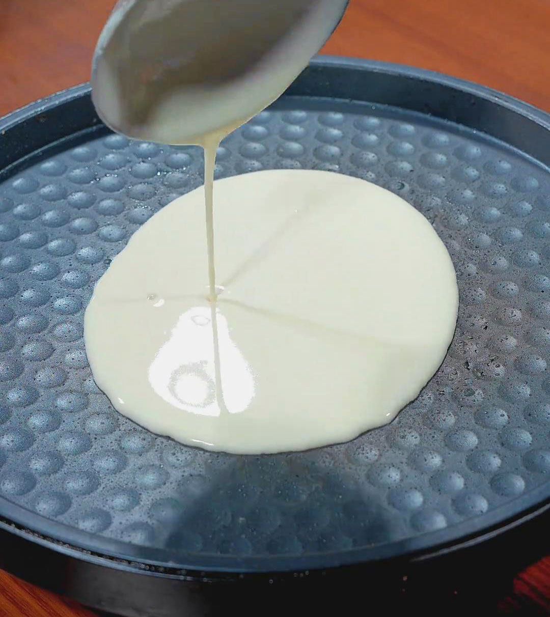 Pour the batter into a heated non stick pan