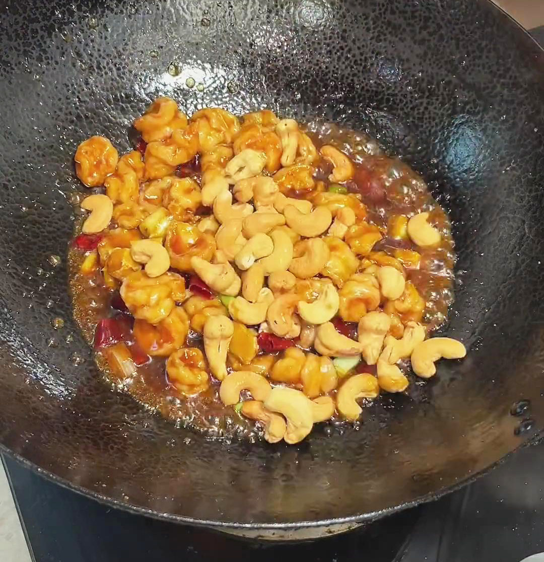 add cashew nuts and stir fry until fully coated