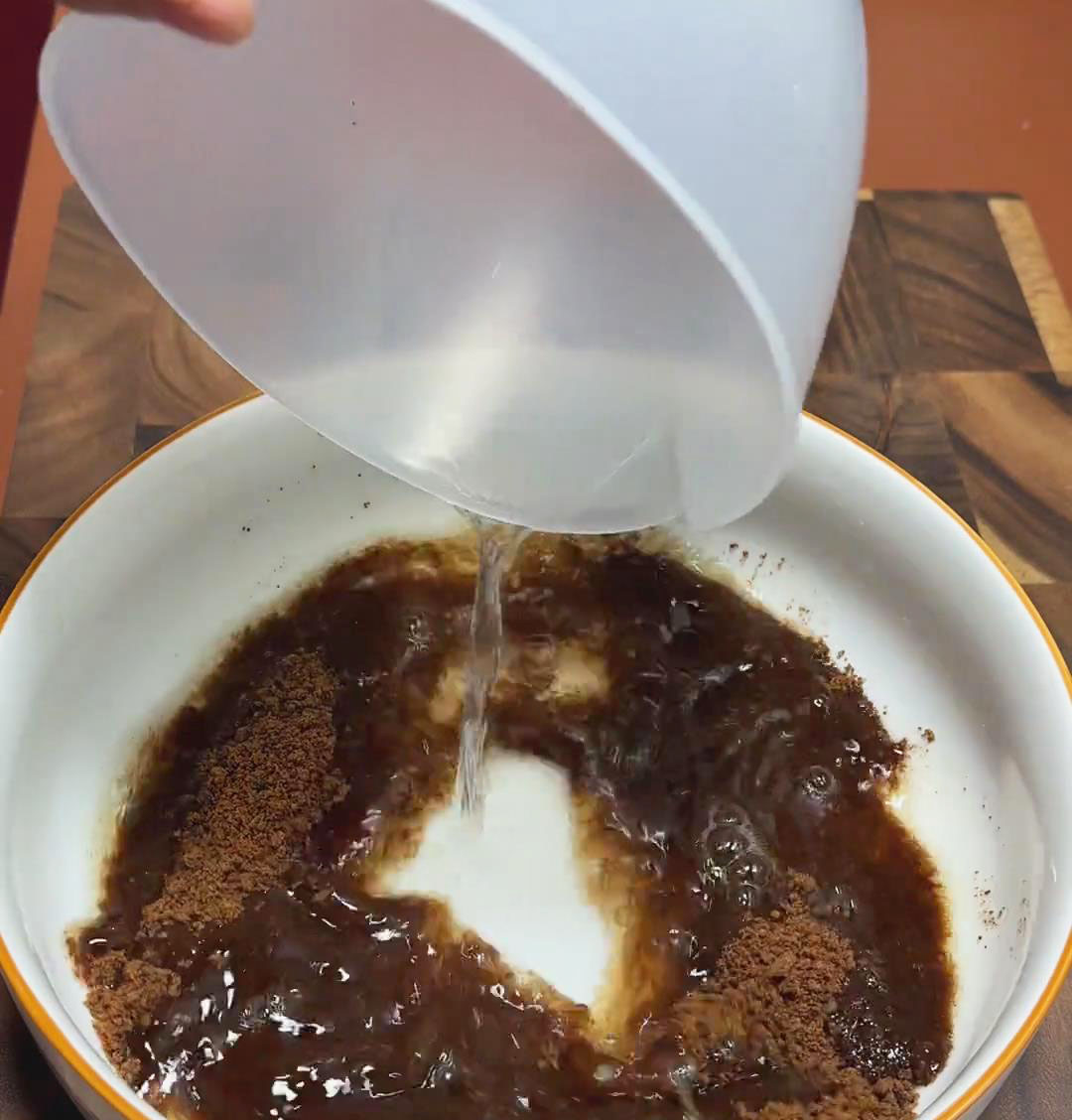 combine brown sugar with hot water