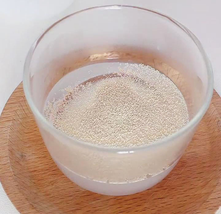 combine the lukewarm water, sugar, and yeast