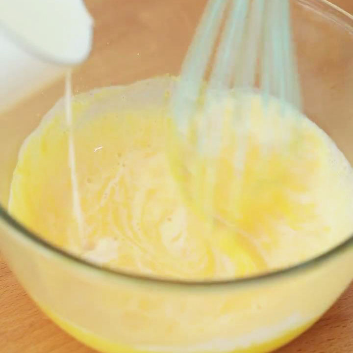 pour the milk mixture into the egg yolk mixture