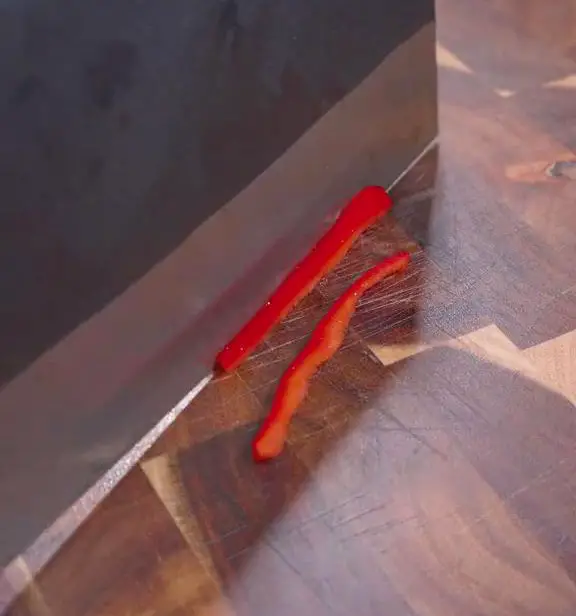 Chop red bell pepper into thin slices