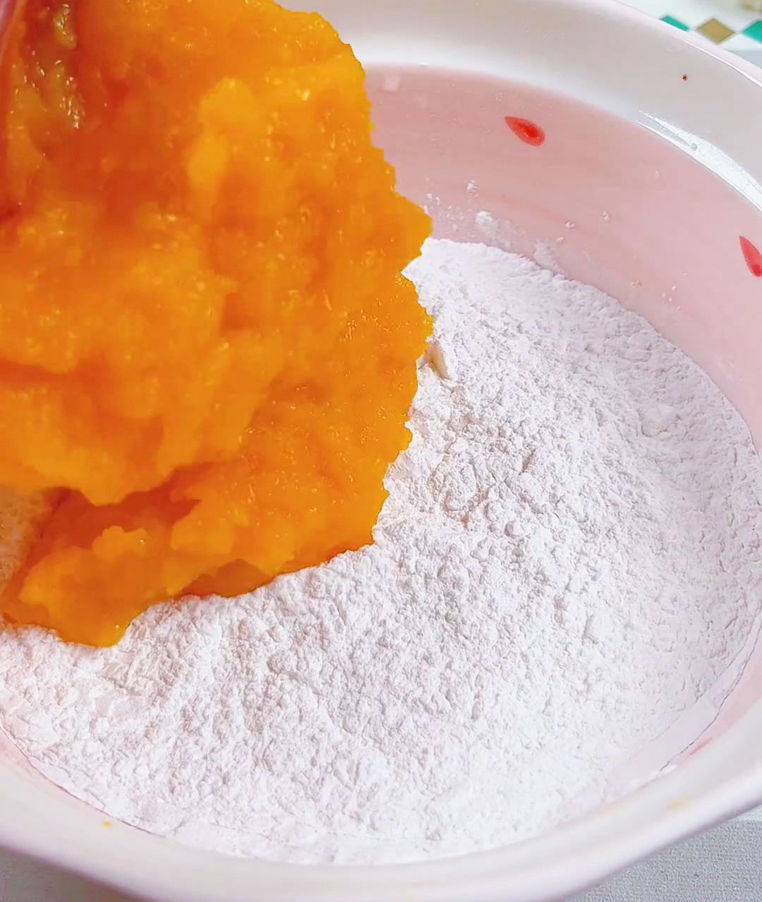 Pour the pumpkin puree into the flour