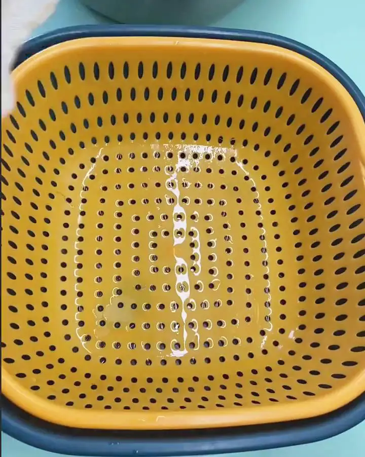 Prepare your clean container with a sieve or a basket with large holes