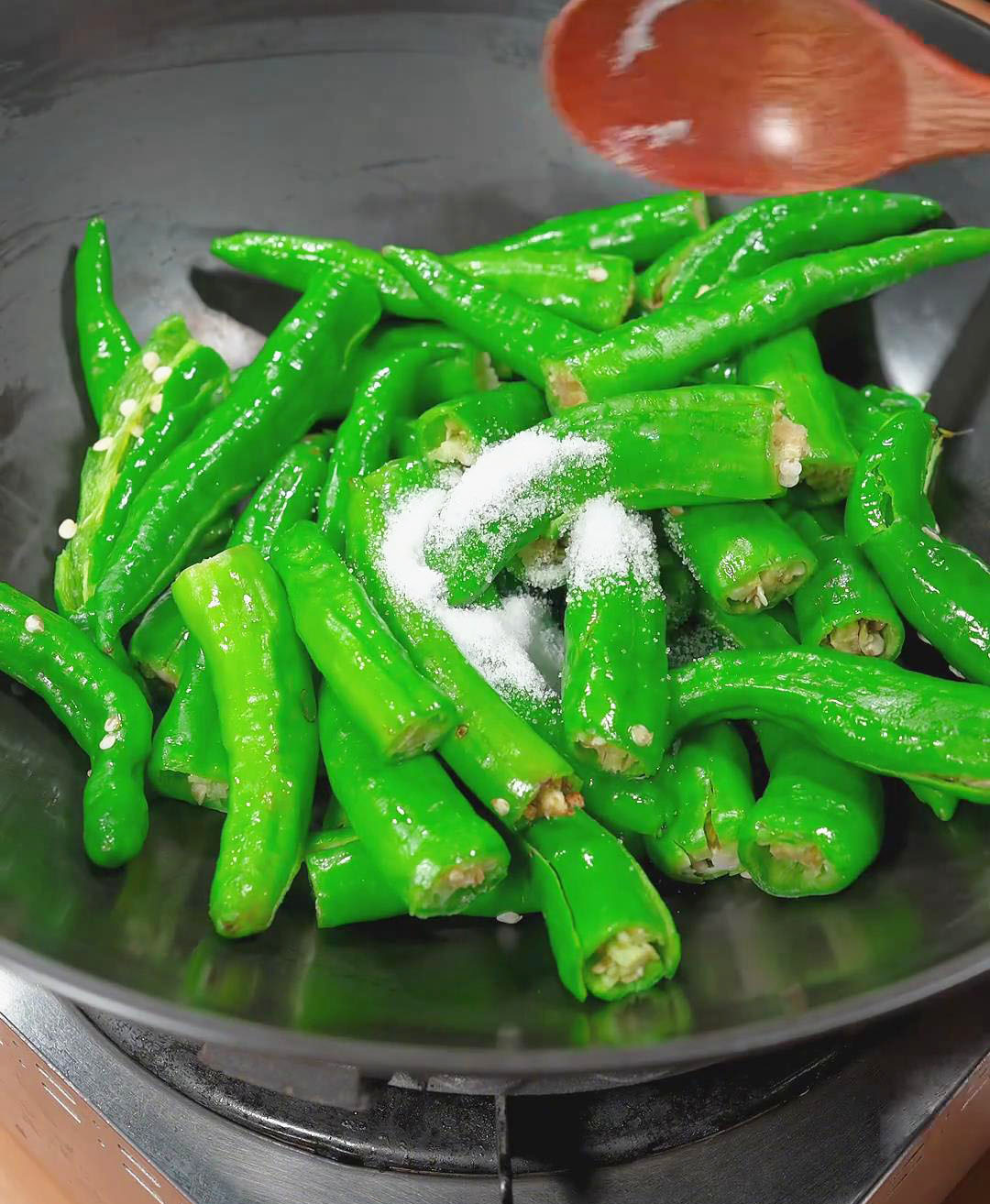 toss in the peppers, and add a pinch of salt